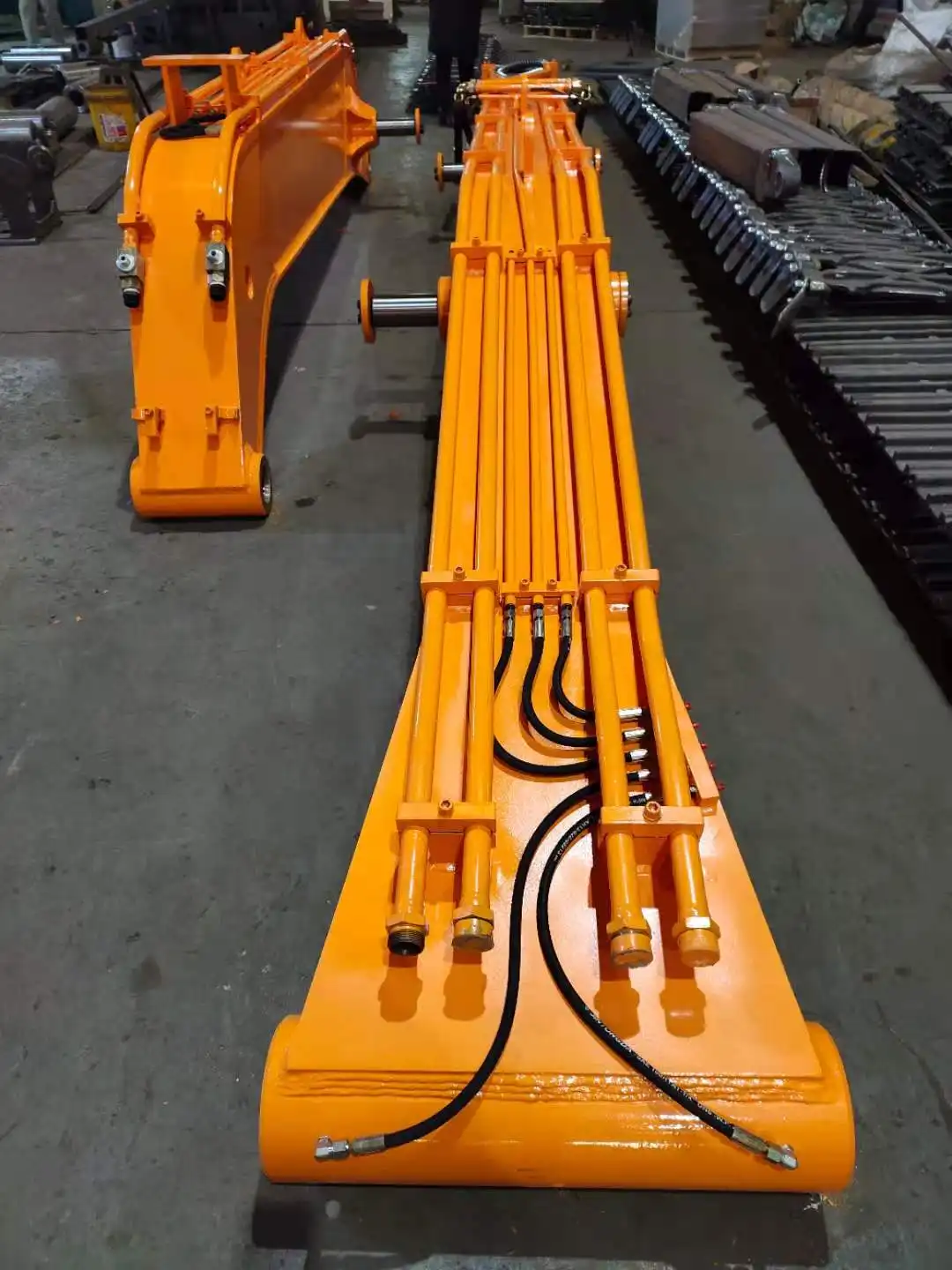 What materials are used to construct the excavator grab arm? 